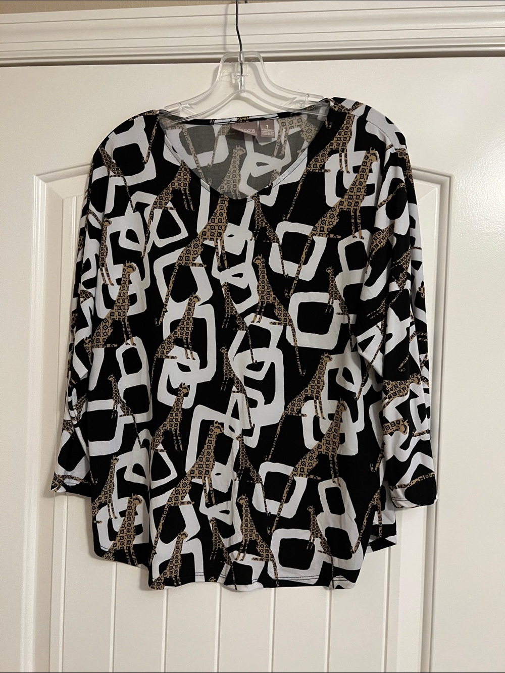 Chicos, Stylish Black & White V-Neck Blouse with Leopard-Accent Print